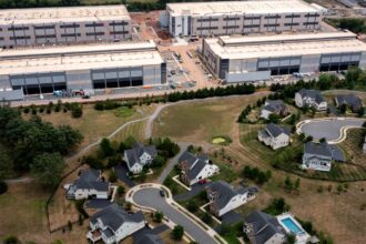 An Amazon Web Services data center situated near single-family homes in Stone Ridge, Virginia. Northern Virginia is the largest data center market in the world.