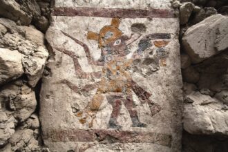 an ancient wall painting in an archaeological site in northern coastal Peru depicting a supernatural being