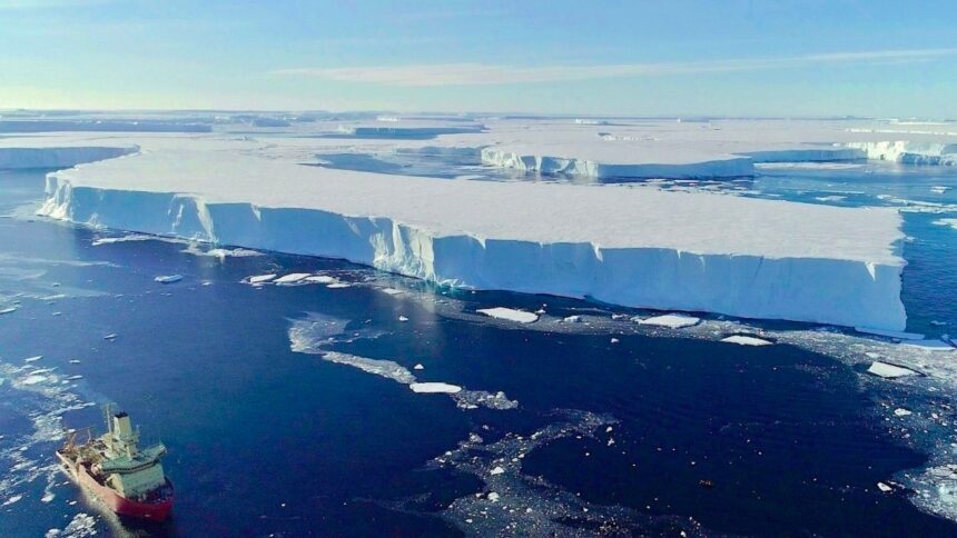 A huge block of ice floats in the water