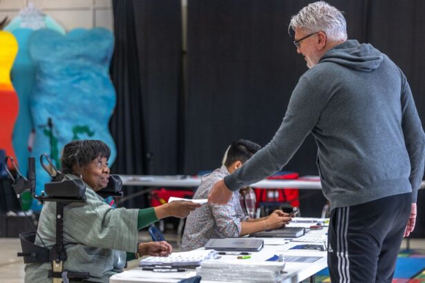 Poll workers assist voters on Super Tuesday at the First Ward Creative Academy, Mecklenburg County Precinct 13 on March 5, 2024 in Charlotte, North Carolina.