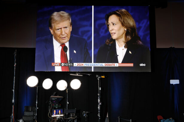 A large split screen shows Donald Trump on the left and Kamala Harris on the right during the 2024 presidential debate