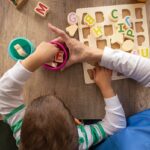 Nurse helps boy with autism learn letters