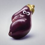 An eggplant with googly eyes