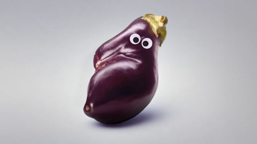 An eggplant with googly eyes