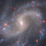 A spiral galaxy shown in a composite image from the James Webb Space Telescope and Hubble Space Telescope