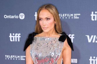 Jennifer Lopez Stuns in Side-Baring Gown on TIFF Red Carpet