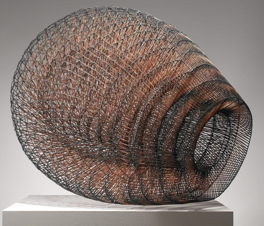 a steel sculpture made of tiny thin pieces of metal welded together in a layered basket-type shape