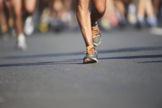 Marathon runners dodge disaster as car takes a detour