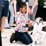 A girl with a robot at New Scientist Live