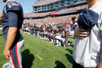 September 24, Protesting NFL players take a knee