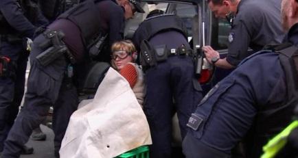 Woman sets hand in concrete as Melbourne protest continues