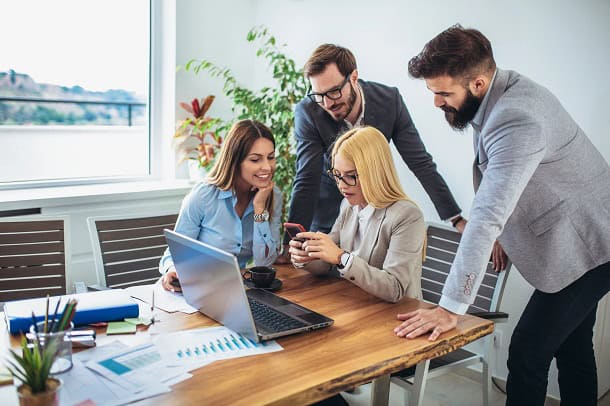 Co-workers looking at a woman