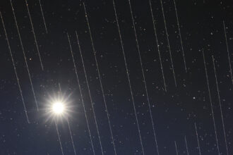 Satellites leave light streaks in the sky.