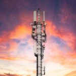 Mobile phone antenna station at sunset