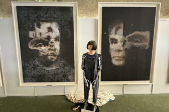 A humanoid robot's painting called 'AI God' may sell for over $120,000