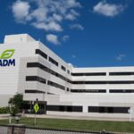 A multistory commercial building that says ADM