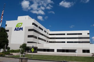 A multistory commercial building that says ADM