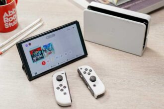 Nintendo Switch OLED in white on a desk