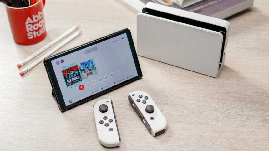 Nintendo Switch OLED in white on a desk