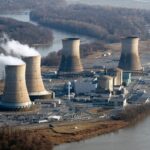 Cooling towers emit steam at Three Mile Island nuclear power plant.