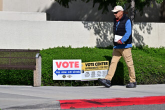 A man makes his way to vote at the Orange County Registrar in Santa Ana, California, on March 5.