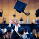 A gradation hat thrown into the air.