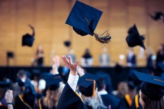 A gradation hat thrown into the air.