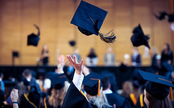 A gradation hat thrown into the air.