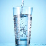 water being poured into a clear glass