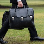 A military aide carries the "nuclear football."