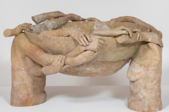 fragmented arms and hands appear to conjoin and hold up a terracotta bowl