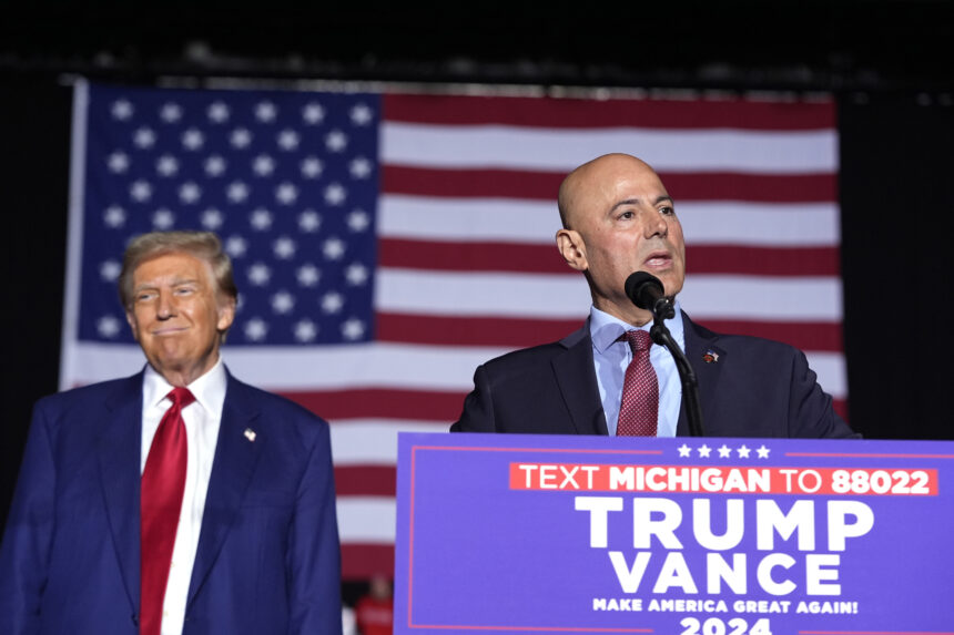 Bazzi speaks beside Trump at a campaign rally Oct. 26 in Novi, Michigan.