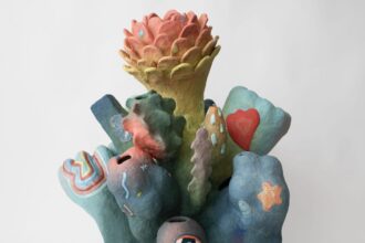 an abstract, colorful ceramic sculpture with nature-inspired elements evocative of coral or flowers