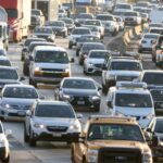 Heavy afternoon traffic moves along the I-5 in Los Angeles, California.