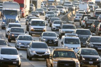 Heavy afternoon traffic moves along the I-5 in Los Angeles, California.