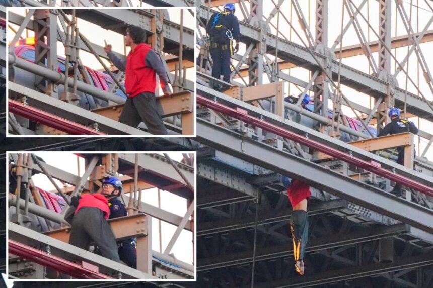 Man dangling off Brooklyn Bridge flips bird to cops trying to save him