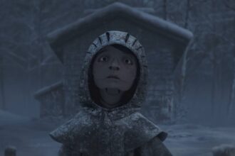 a still from a short film titled 'Return to Hairy Hill,' featuring a young girl with a paper-like face, looking up past the viewer