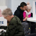 US voters cast ballots in tight race