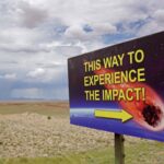 2HAJ7KN This way to experience the impact - sign on the road to Meteor Crater, Northern Arizona, USA