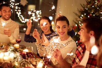 Happy friends at the dinner for New Year