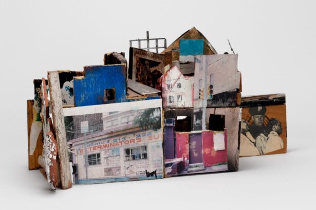 a sculpture of an abstract house made from ceramics, found objects, photographs, and other mixed media