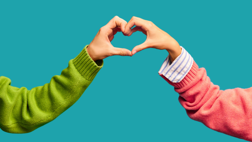 Photo of two hands creating a heart during a teacher pep talk