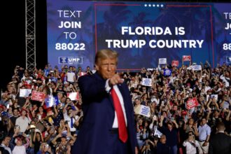 Donald Trump stands on stage during a campaign rally in Hialeah, Florida. He has won the disaster-prone state three times.