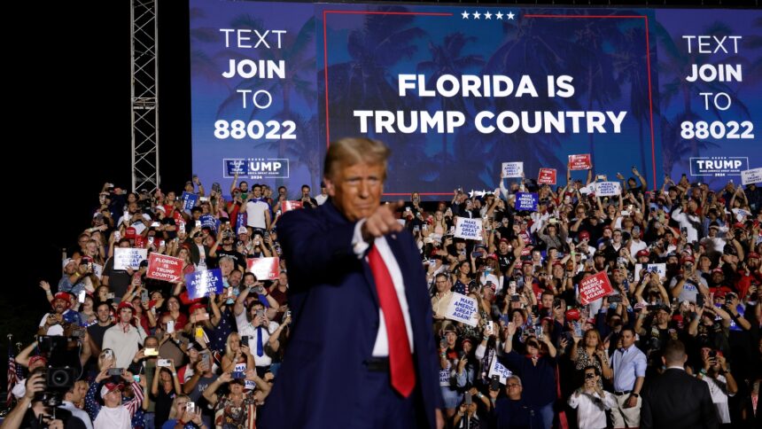 Donald Trump stands on stage during a campaign rally in Hialeah, Florida. He has won the disaster-prone state three times.