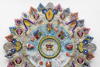 an abstract glass sculpture in the form of an Aztec calendar with numerous mixed-media details and patterns