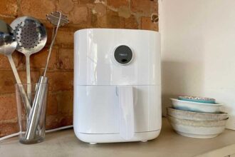 Clean white Xiaomi air fryer with kitchen accessories