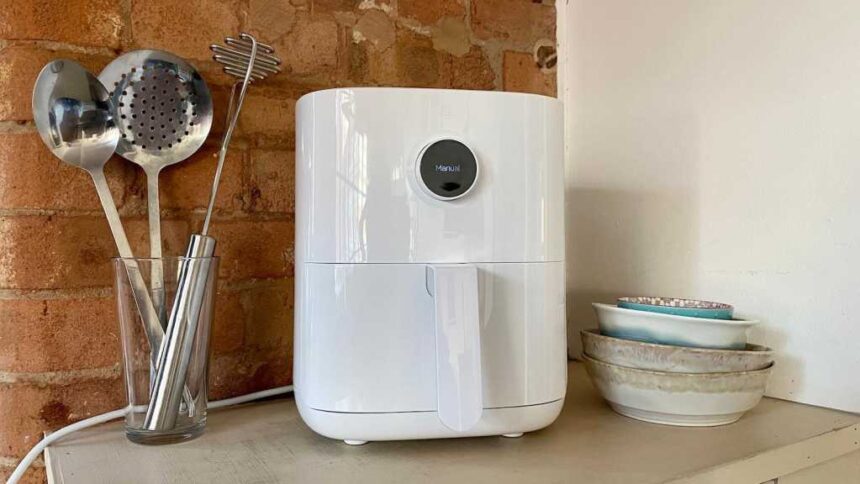 Clean white Xiaomi air fryer with kitchen accessories