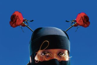 a striking portrait of a figure wearing a niqab, with roses on her head and wire worn like glasses in front of her eyes that reads "love"