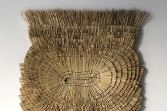 an abstract wall hanging made from rice straw