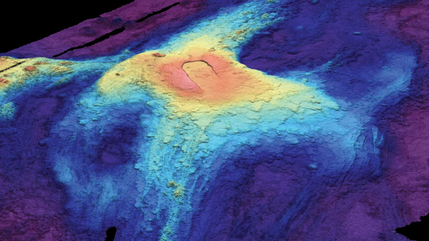 A heat map image of the ocean floor shows bloblike circles of red, yellow, and blues fading out from the volcano